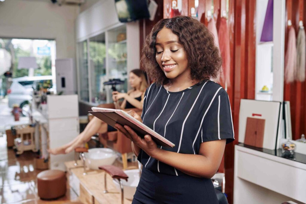 beauty salon manager checking booking