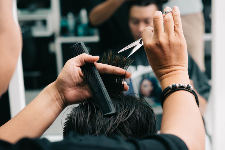 A smartphone displaying a reminder notification for a hair stylist appointment